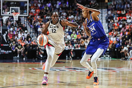 Sep 18, 2022; Uncasville, Connecticut, USA; Las Vegas Aces guard Chelsea Gray (12) and Connecticut Sun forward DeWanna Bonner (24) during game four of the 2022 WNBA Finals at Mohegan Sun Arena. Mandatory Credit: Wendell Cruz-USA TODAY Sports