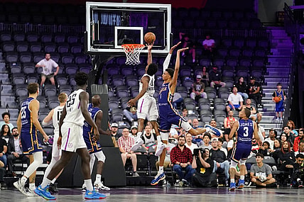 Oct 4, 2022; Henderson, NV, USA; NBA G League Ignite guard Scoot Henderson (0) scores a layup against Boulogne-Levallois Metropolitans 92 forward Victor Wembanyama (1) during the fourth quarter at The Dollar Loan Center. Mandatory Credit: Lucas Peltier-USA TODAY Sports