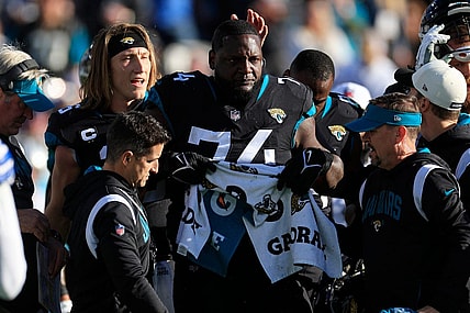 Jacksonville Jaguars offensive lineman Cam Robinson (74) tears up after an apparent injury as quarterback Trevor Lawrence (16) pats him on the head during the fourth quarter of a regular season NFL football matchup Sunday, Dec. 18, 2022 at TIAA Bank Field in Jacksonville. The Jacksonville Jaguars edged the Dallas Cowboys 40-34 in overtime.

Pom Dec 09