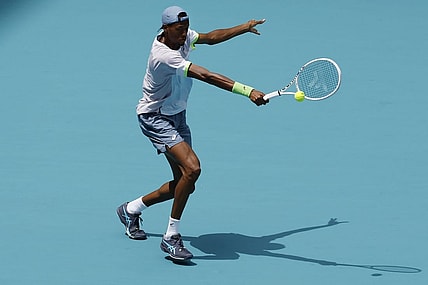 Mar 30, 2023; Miami, Florida, US; Christopher Eubanks (USA) hits a backhand against Daniil Medvedev (not pictured) in a men's singles quarterfinal in the Miami Open at Hard Rock Stadium. Mandatory Credit: Geoff Burke-USA TODAY Sports