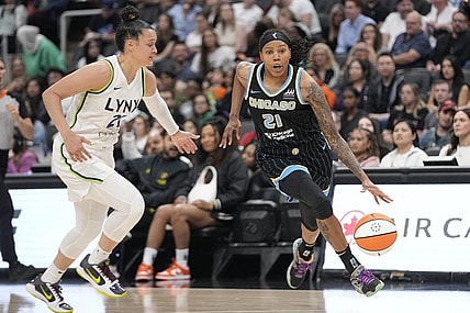 May 13, 2023; Toronto, Ontario, Canada; Chicago Sky forward Robyn Parks (21) dribbles around Minnesota Lynx guard Kayla McBride (21) during the first half at Scotiabank Arena. Mandatory Credit: John E. Sokolowski-USA TODAY Sports