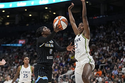 May 13, 2023; Toronto, Ontario, Canada; Chicago Sky guard Kahleah Copper (2) goes up to make a basket as Minnesota Lynx forward Diamond Miller (1) defends during the first half at Scotiabank Arena. Mandatory Credit: John E. Sokolowski-USA TODAY Sports