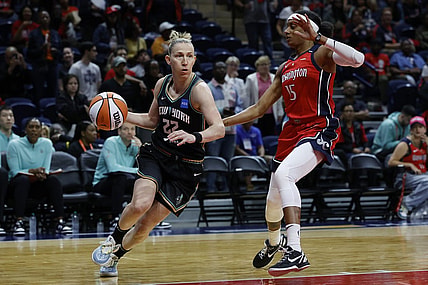 May 19, 2023; Washington, District of Columbia, USA; New York Liberty guard Courtney Vandersloot (22) drives to the basket as Washington Mystics guard Brittney Sykes (15) defends at Entertainment & Sports Arena. Mandatory Credit: Geoff Burke-USA TODAY Sports