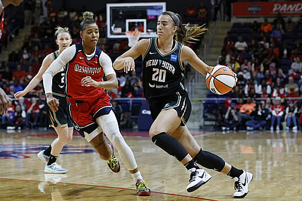 May 19, 2023; Washington, District of Columbia, USA; New York Liberty guard Sabrina Ionescu (20) drives to the basket as Washington Mystics guard Natasha Cloud (9) defends at Entertainment & Sports Arena. Mandatory Credit: Geoff Burke-USA TODAY Sports