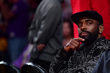 May 22, 2023; Los Angeles, California, USA; American professional basketball player Kyrie Irving watches from the baseline during the second quarter between the Los Angeles Lakers and the Denver Nuggets in game four of the Western Conference Finals for the 2023 NBA playoffs at Crypto.com Arena. Mandatory Credit: Gary A. Vasquez-USA TODAY Sports