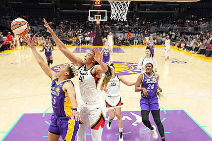 May 25, 2023; Los Angeles, California, USA; LA Sparks guard Layshia Clarendon (25) shoots the ball against Las Vegas Aces center Kiah Stokes (41) during the second half at Crypto.com Arena. Mandatory Credit: Kirby Lee-USA TODAY Sports