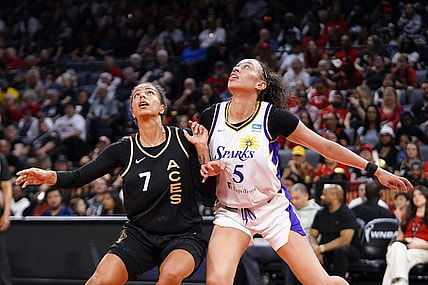May 27, 2023; Las Vegas, Nevada, USA; Los Angeles Sparks forward Dearica Hamby (5) battles for position against Las Vegas Aces forward Alysha Clark (7) during the first quarter at Michelob Ultra Arena. Mandatory Credit: Lucas Peltier-USA TODAY Sports