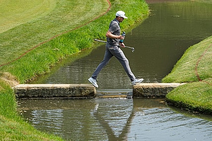June 3, 2023; Dublin, Ohio, USA;  Keegan Bradley crosses the creek as he walks to the 14th green during the third round of the Memorial Tournament at Muirfield Village Golf Club.
