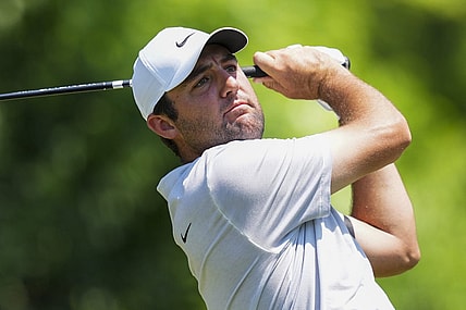 Jun 4, 2023; Dublin, Ohio, USA; Scottie Scheffler plays his shot from the 15th tee during the final round of the Memorial Tournament golf tournament at the Muirfield Village Golf Club. Mandatory Credit: Aaron Doster-USA TODAY Sports