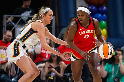 Jun 4, 2023; Indianapolis, Indiana, USA; Las Vegas Aces guard Jackie Young (0) dribbles the ball while Indiana Fever guard Lexie Hull (10) defends in the first half at Gainbridge Fieldhouse. Mandatory Credit: Trevor Ruszkowski-USA TODAY Sports