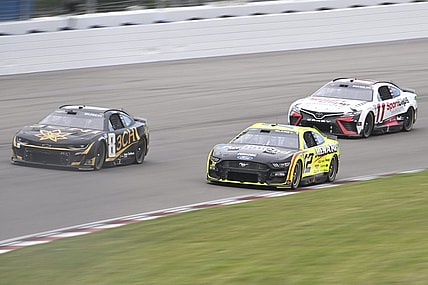 Jun 4, 2023; Madison, Illinois, USA; NASCAR Cup Series driver Kyle Busch (8) leads NASCAR Cup Series driver Ryan Blaney (12) and NASCAR Cup Series driver Denny Hamlin (11) during the Enjoy Illinois 300 at World Wide Technology Raceway. Mandatory Credit: Joe Puetz-USA TODAY Sports