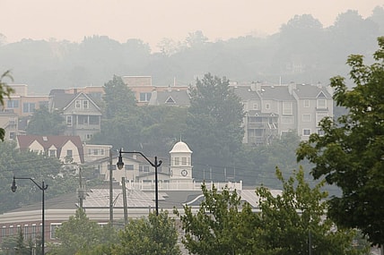 A smoky haze surrounds Tarrytown Village Hall and nearby residences June 7, 2023. The state Department of Environmental Conservation issued air quality advisories for most of New York due to smoke from wildfires in Canada.