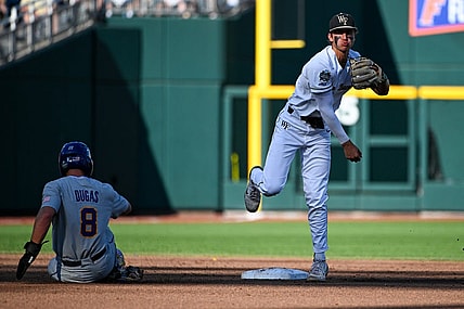Jun 19, 2023; Omaha, NE, USA;  Wake Forest Demon Deacons shortstop Marek Houston (7) completes a double play against Wake Forest Demon Deacons first baseman Nick Kurtz (8) in the second inning at Charles Schwab Field Omaha. Mandatory Credit: Steven Branscombe-USA TODAY Sports