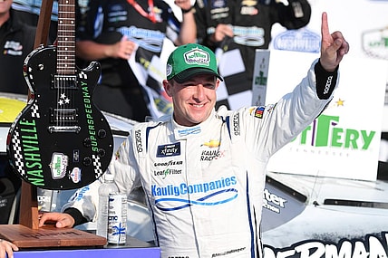 Jun 24, 2023; Nashville, Tennessee, USA; NASCAR Xfinity Series driver AJ Allmendinger (10) and his team celebrate winning the Tennessee Lottery 250 at Nashville Superspeedway. Mandatory Credit: Christopher Hanewinckel-USA TODAY Sports
