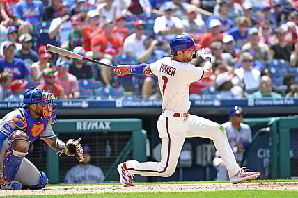 Jun 25, 2023; Philadelphia, Pennsylvania, USA; Philadelphia Phillies shortstop Trea Turner (7) hits an RBI single against the New York Mets during the third inning at Citizens Bank Park. Mandatory Credit: Eric Hartline-USA TODAY Sports