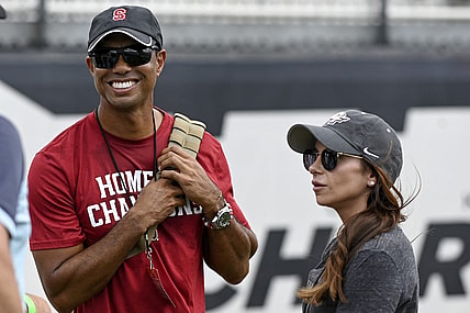 Sep 14, 2019; Orlando, FL, USA; PGA golfer Tiger Woods (red shirt) and girlfriend Erica Herman look on prior to the game between the UCF Knights and the Stanford Cardinals at Spectrum Stadium. Mandatory Credit: Douglas DeFelice-USA TODAY Sports