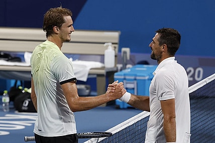 Jul 29, 2021; Tokyo, Japan; Alexander Zverev of Germany (L) shakes hands with Jeremy Chardy of France (R) after their match in a men's singles quarterfinal during the Tokyo 2020 Olympic Summer Games at Ariake Tennis Park. Mandatory Credit: Geoff Burke-USA TODAY Sports