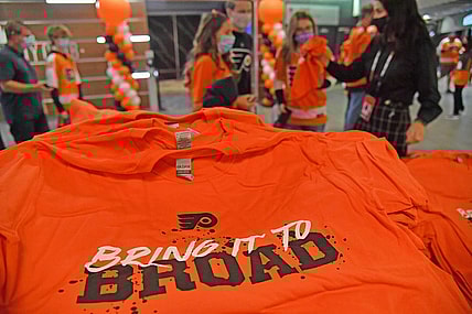 Oct 15, 2021; Philadelphia, Pennsylvania, USA; Philadelphia Flyers fans receive free t-shirt on opening night against the Vancouver Canucks at Wells Fargo Center. Mandatory Credit: Eric Hartline-USA TODAY Sports