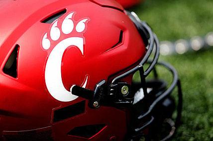 A Cincinnati Bearcats helmet lays on the turf during a spring practice at Nippert Stadium in Cincinnati on Thursday, March 24, 2022.

Cincinnati Bearcats Spring Practice