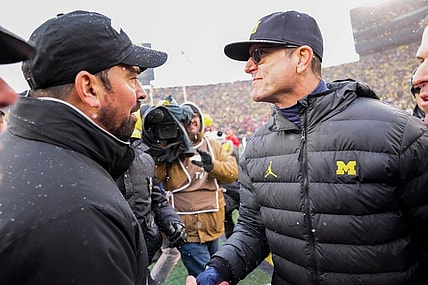 Ohio State coach Ryan Day shakes hands with Michigan coach Jim Harbaugh following Saturday's game.

Img Ohio State Buckeyes 1 1 0euspm7b L1741352332