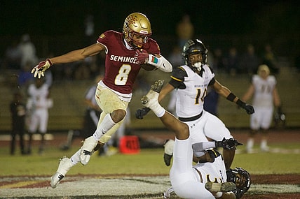 Florida High junior Micahi Danzy (8) leaps through the air in the Class 2S state semifinal matchup between Florida High and Bishop Verot on Dec. 2, 2022, at Mike Hickman Stadium. The Seminoles won, 38-28.

J9t8323