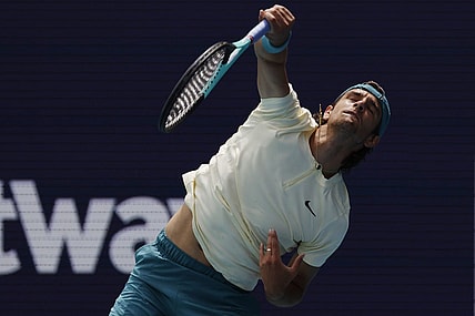 Mar 25, 2023; Miami, Florida, US; Lorenzo Musetti (ITA) serves against Jiri Lehechka (CZE) (not pictured) on day six of the Miami Open at Hard Rock Stadium. Mandatory Credit: Geoff Burke-USA TODAY Sports