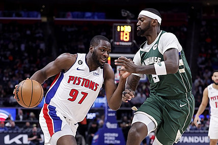 Mar 27, 2023; Detroit, Michigan, USA;  Detroit Pistons forward Eugene Omoruyi (97) dribbles on Milwaukee Bucks forward Bobby Portis (9) in the first half at Little Caesars Arena. Mandatory Credit: Rick Osentoski-USA TODAY Sports