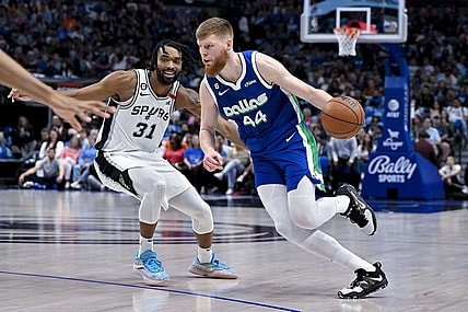 Apr 9, 2023; Dallas, Texas, USA; Dallas Mavericks forward Davis Bertans (44) drives to the basket past San Antonio Spurs forward Keita Bates-Diop (31) during the second quarter at the American Airlines Center. Mandatory Credit: Jerome Miron-USA TODAY Sports