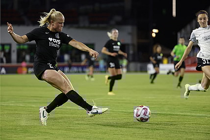 May 10, 2023; Washington, D.C., USA; Washington Spirit attacker Civana Kuhlmann (20) passes the ball as Orlando Pride defender Brianna Mart nez (32) defends in the second half of a UKG Challenge Cup match at Audi Field. Mandatory Credit: Geoff Burke-USA TODAY Sports