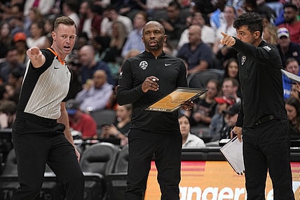 May 13, 2023; Toronto, Ontario, Canada; Chicago Sky head coach James Wade (center) listens to referee Kevin Fahy during the first half against the Minnesota Lynx at Scotiabank Arena. Mandatory Credit: John E. Sokolowski-USA TODAY Sports