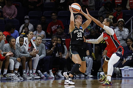 May 19, 2023; Washington, District of Columbia, USA; New York Liberty guard Sabrina Ionescu (20) holds the ball as Washington Mystics guard Natasha Cloud (9) defends at Entertainment & Sports Arena. Mandatory Credit: Geoff Burke-USA TODAY Sports