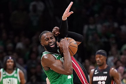 May 29, 2023; Boston, Massachusetts, USA; Boston Celtics guard Jaylen Brown (7) battles for control against Miami Heat guard Max Strus (31) in the first quarter during game seven of the Eastern Conference Finals for the 2023 NBA playoffs at TD Garden. Mandatory Credit: David Butler II-USA TODAY Sports