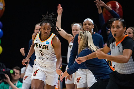 Jun 4, 2023; Indianapolis, Indiana, USA; Indiana Fever guard Kelsey Mitchell (0) celebrates a three point basket with the bench in the second half against the Las Vegas Aces at Gainbridge Fieldhouse. Mandatory Credit: Trevor Ruszkowski-USA TODAY Sports