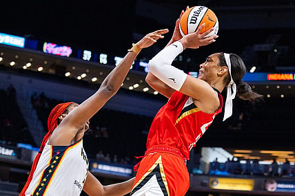 Jun 4, 2023; Indianapolis, Indiana, USA; Las Vegas Aces forward A'ja Wilson (22) shoots the ball while Indiana Fever center Aliyah Boston (7) defends in the second half at Gainbridge Fieldhouse. Mandatory Credit: Trevor Ruszkowski-USA TODAY Sports