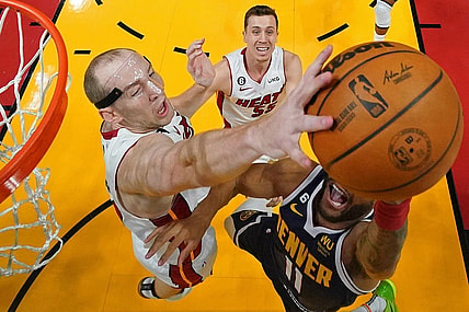Jun 9, 2023; Miami, Florida, USA; Miami Heat center Cody Zeller (44) blocks the shot of Denver Nuggets forward Bruce Brown (11) during the first half in game four of the 2023 NBA Finals at Kaseya Center. Mandatory Credit: Kyle Terada-USA TODAY Sports