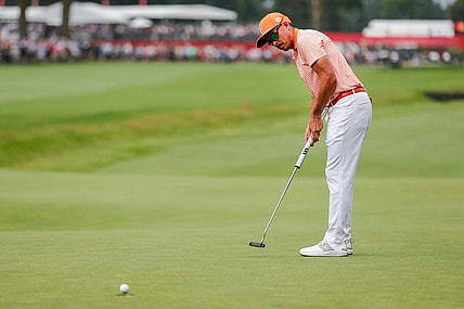 Rickie Fowler putts a birdie on the 18th hole at the first playoff round during the fourth round of Rocket Mortgage Classic at Detroit Golf Club in Detroit on Sunday, July 2, 2023.