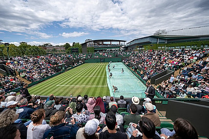 Jul 5, 2023; London, United Kingdom; The grounds staff uncover Court 3 so play will resume on day three of Wimbledon at the All England Lawn Tennis and Croquet Club.  Mandatory Credit: Susan Mullane-USA TODAY Sports