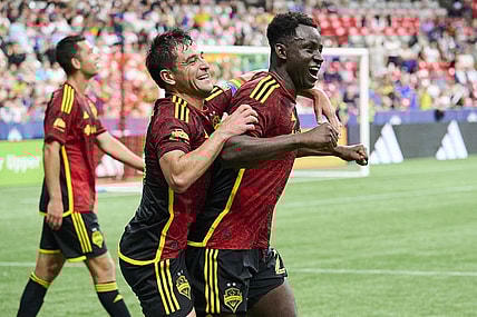 Jul 8, 2023; Vancouver, British Columbia, CAN; Seattle Sounders defender Yeimar Gomez (28) celebrates with midfielder Nicolas Lodeiro (10) after scoring the game winning goal during the second half against the Vancouver Whitecaps at BC Place. Mandatory Credit: Troy Wayrynen-USA TODAY Sports