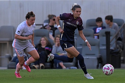 Jul 9, 2023; Los Angeles, California, USA; North Carolina Courage defender Malia Berkely (7) handles the ball against Angel City FC during the first half at BMO Stadium. Mandatory Credit: Jayne Kamin-Oncea-USA TODAY Sports