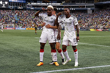 Jul 15, 2023; Seattle, Washington, USA; FC Dallas forward Bernard Kamungo (77) celebrates with forward Jader Obrian (8) after scoring a goal against the Seattle Sounders FC during the first half at Lumen Field. Mandatory Credit: Joe Nicholson-USA TODAY Sports