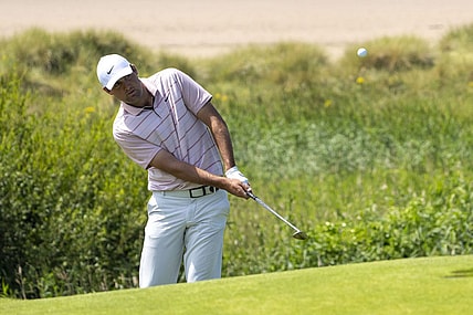 July 19, 2023; Hoylake, ENGLAND, GBR; Scottie Scheffler hits a chip shot on the 17th hole during a practice round of The Open Championship golf tournament at Royal Liverpool. Mandatory Credit: Kyle Terada-USA TODAY Sports