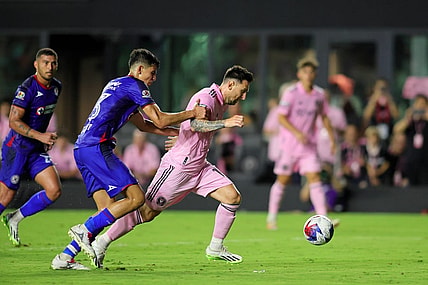 Jul 21, 2023; Fort Lauderdale, FL, USA; Inter Miami CF forward Lionel Messi (10) dribbles the ball against Cruz Azul defender Rafael Guerrero (33) during the second half at DRV PNK Stadium. Mandatory Credit: Sam Navarro-USA TODAY Sports