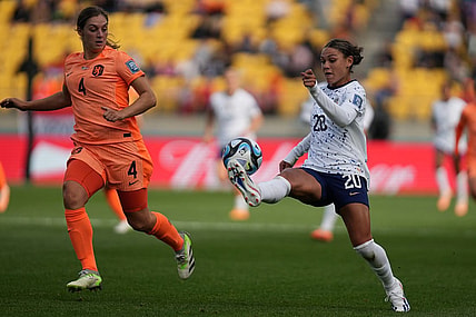Jul 27, 2023; Wellington, NZL; United States forward Trinity Rodman (20) kicks the ball past Netherlands defender Aniek Nouwen (4) during the second half in a group stage match for the 2023 FIFA Women's World Cup at Wellington Regional Stadium. Mandatory Credit: Jenna Watson-USA TODAY Sports
