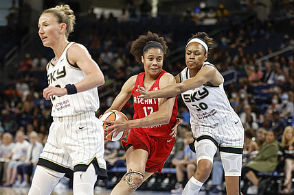 Jun 17, 2022; Chicago, Illinois, USA; Atlanta Dream forward Nia Coffey (12) drives to the basket against Chicago Sky forward Azura Stevens (30) during the first half of a WNBA game at Wintrust Arena. Mandatory Credit: Kamil Krzaczynski-USA TODAY Sports