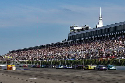 Jul 24, 2022; Long Pond, Pennsylvania, USA; NASCAR Cup Series driver Kyle Busch (18) leads the field on a restart during the M&M   S Fan Appreciation 400 at Pocono Raceway. Mandatory Credit: Matthew OHaren-USA TODAY Sports