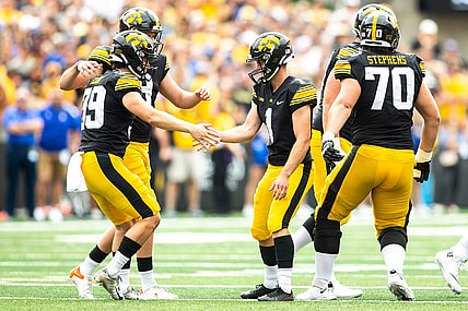 Iowa placekicker Aaron Blom (1) celebrates with longsnapper Luke Elkin, left, and holder Tory Taylor during a NCAA football game against South Dakota State, Saturday, Sept. 3, 2022, at Kinnick Stadium in Iowa City, Iowa.

220903 Sdsu Iowa Fb 020 Jpg