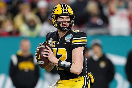 Dec 23, 2022; Tampa, Florida, USA; Missouri Tigers quarterback Brady Cook (12) drops back to pass against the Wake Forest Demon Deacons in the first quarter in the 2022 Gasparilla Bowl at Raymond James Stadium. Mandatory Credit: Nathan Ray Seebeck-USA TODAY Sports