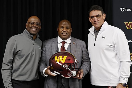 Feb 23, 2023; Ashburn, Virginia, USA; Eric Bieniemy (M) poses with Washington Commanders general manager Martin Mayhew (L) and Commanders head coach Ron Rivera (R) after being introduced as the new Commanders offensive coordinator and assistant head coach during an introductory press conference at Commanders Park. Mandatory Credit: Geoff Burke-USA TODAY Sports