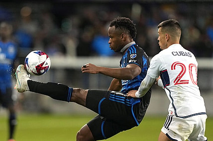 Mar 4, 2023; San Jose, California, USA; San Jose Earthquakes forward Jeremy Ebobisse (11) controls the ball against Vancouver Whitecaps midfielder Andres Cubas (20) during the second half at PayPal Park. Mandatory Credit: Darren Yamashita-USA TODAY Sports