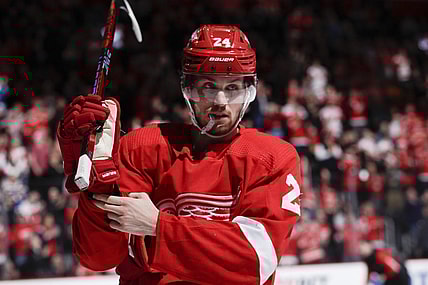 Mar 23, 2023; Detroit, Michigan, USA; Detroit Red Wings center Pius Suter (24) adjusts his glove during the second period against the St. Louis Blues at Little Caesars Arena. Mandatory Credit: Brian Bradshaw Sevald-USA TODAY Sports
